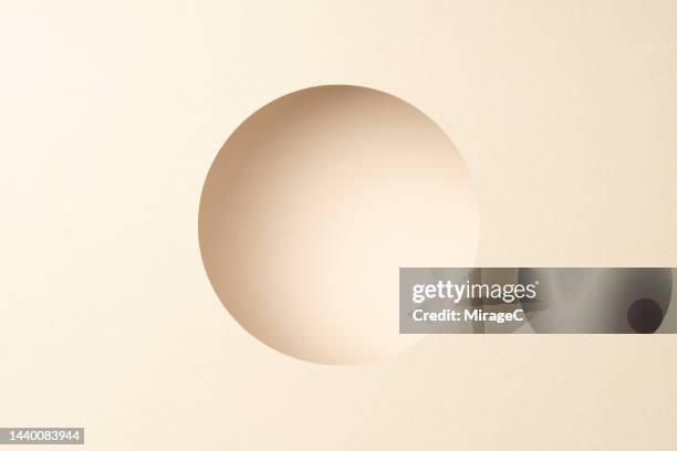 round frame composed of layered beige paper - keyhole stock pictures, royalty-free photos & images