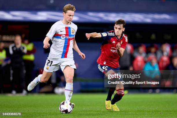 Frenkie de Jong of FC Barcelona competes for the ball with Aimar Oroz of CA Osasuna during the LaLiga Santander match between CA Osasuna and FC...