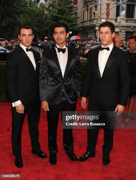 Nick Jonas, Kevin Jonas and Joe Jonas attend the "Schiaparelli And Prada: Impossible Conversations" Costume Institute Gala at the Metropolitan Museum...