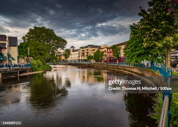 scenic view of river by buildings against sky,sligo,ireland - sligo stock pictures, royalty-free photos & images