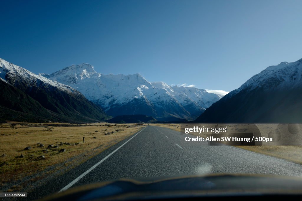 Scenic view of road along snow capped mountainside,Canterbury,New Zealand