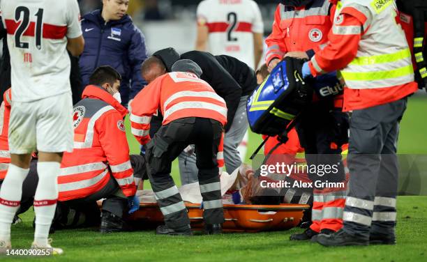 Wataru Endo of VfB Stuttgart is stretchered off the pitch following an injury during the Bundesliga match between VfB Stuttgart and Hertha BSC at...