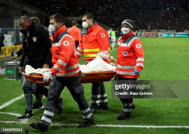 Wataru Endo of VfB Stuttgart is stretchered off the pitch following an injury during the Bundesliga match between VfB Stuttgart and Hertha BSC at...
