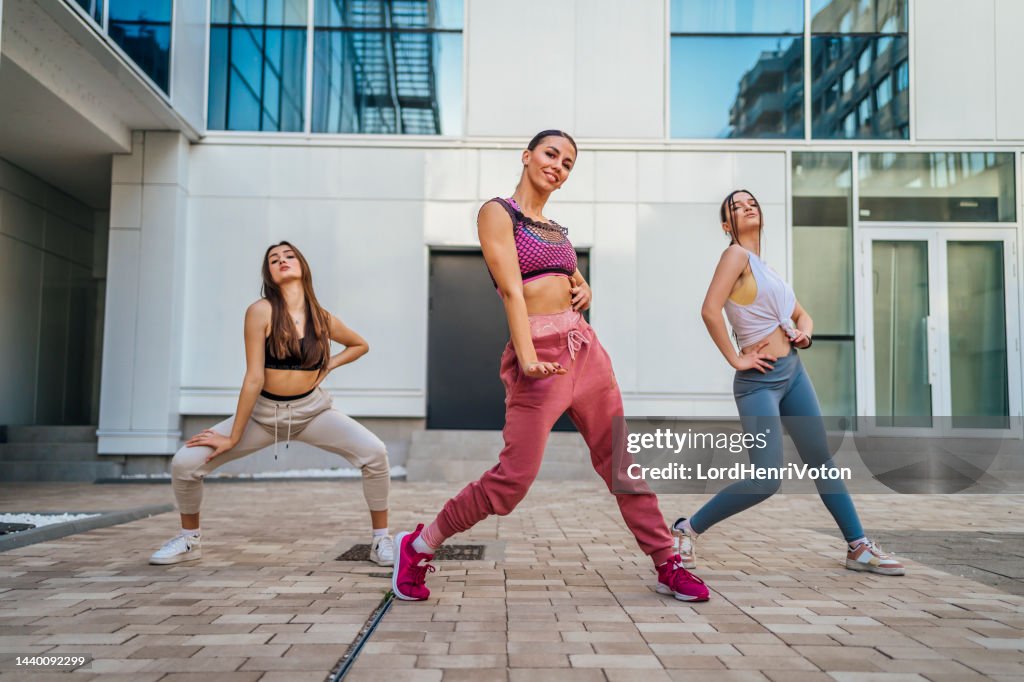 Three female dancers outdoors