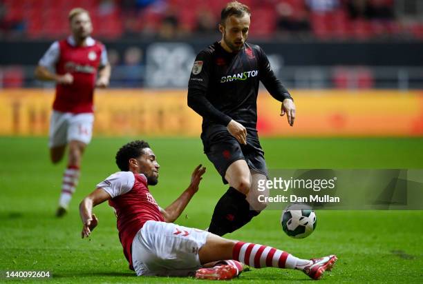 Charles Vernam of Lincoln City is tackled by Zak Vyner of Bristol City during the Carabao Cup Third Round match between Bristol City and Lincoln City...