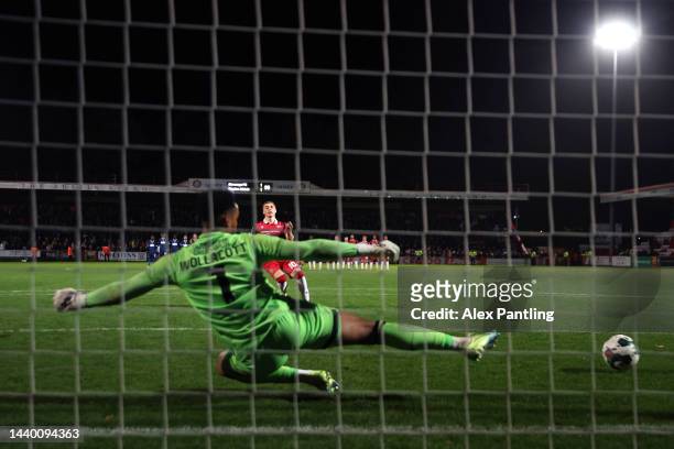 Dean Campbell of Stevenage scores during the penalty shoot-out during the Carabao Cup Third Round match between Stevenage and Charlton Athletic at...