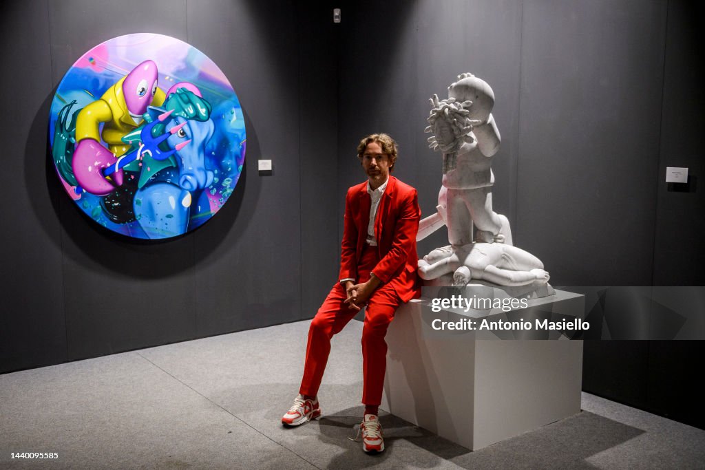 British artist Philip Colbert poses near his artworks at San... News ...