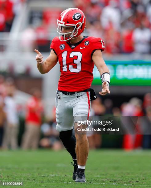 Stetson Bennett of the Georgia Bulldogs reacts after a touchdown in the first half against the Tennessee Volunteers at Sanford Stadium on November 5,...