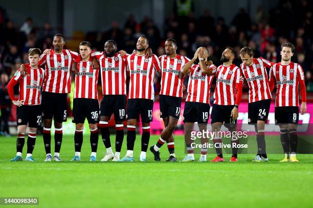 Players of Brentford react during the penalty shoot out during the Carabao Cup Third Round match between Brentford and Gillingham at Brentford...