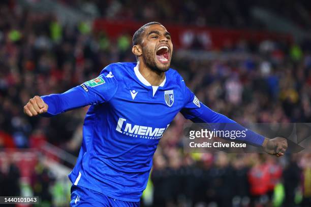 Mikael Mandron of Gillingham celebrates scoring their penalty in the shootout during the Carabao Cup Third Round match between Brentford and...