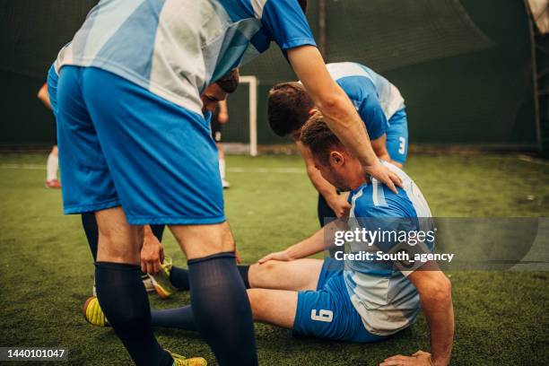 Help Football Soccer Player Helping Opponent Photos and Premium High Res Pictures ...