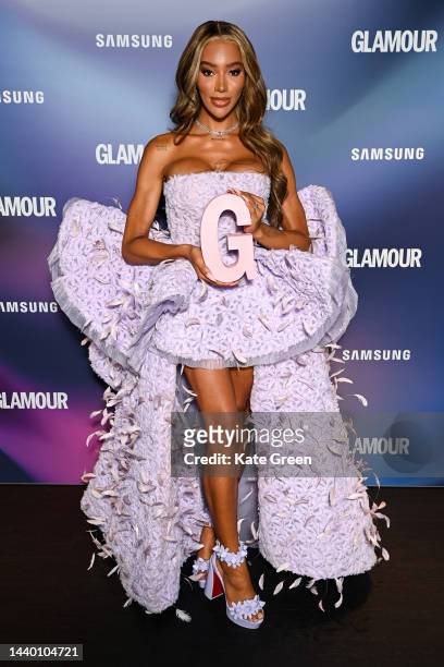 Munroe Bergdorf poses with the Beauty game changer award in the winners room at the Glamour Women of the Year Awards 2022 at Outernet London on...