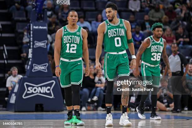 Grant Williams Jayson Tatum and Marcus Smart of the Boston Celtics stand on the court during the game against the Memphis Grizzlies at FedExForum on...