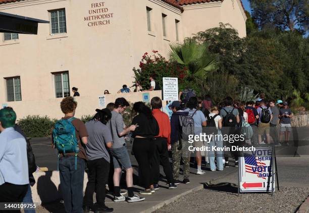 Voters wait to cast their ballots on November 08, 2022 in Tucson, Arizona. After months of candidates campaigning, Americans are voting in the...