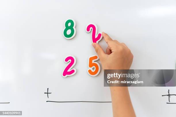 Math Problem With Magnets Whiteboard Magnets Photos and Premium High Res Pictures - Getty Images