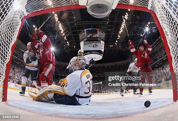 Mikkel Boedker and Antoine Vermette # of the Phoenix Coyotes celebrate after Derek Morris scored a first period goal past goaltender Pekka Rinne of...