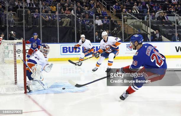 Chris Kreider of the New York Rangers scores a powerplay goal at 22 seconds of the second period against Semyon Varlamov of the New York Islanders at...