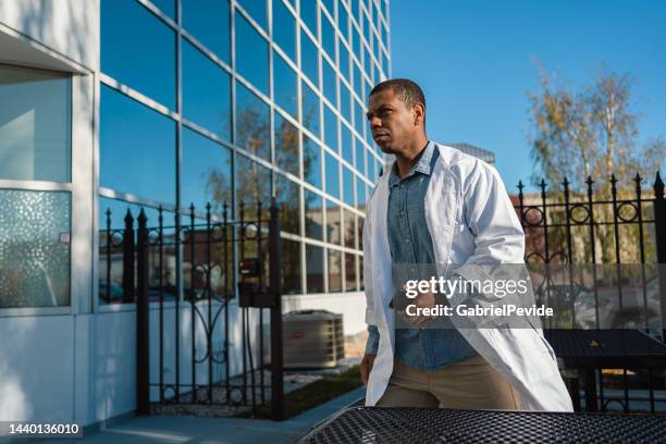 doctor walking the streets waiting for call - government scrutiny stock pictures, royalty-free photos & images