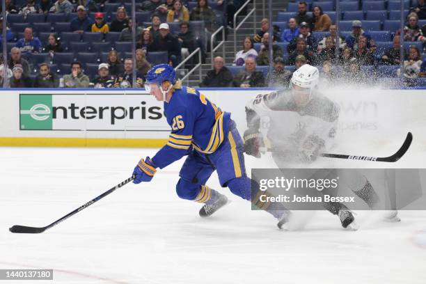 Rasmus Dahlin of the Buffalo Sabres skates against Jack McBain of the Arizona Coyotes during the third period of an NHL hockey game at KeyBank Center...