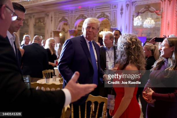 Former U.S. President Donald Trump mingles with supporters during an election night event at Mar-a-Lago on November 08, 2022 in Palm Beach, Florida....
