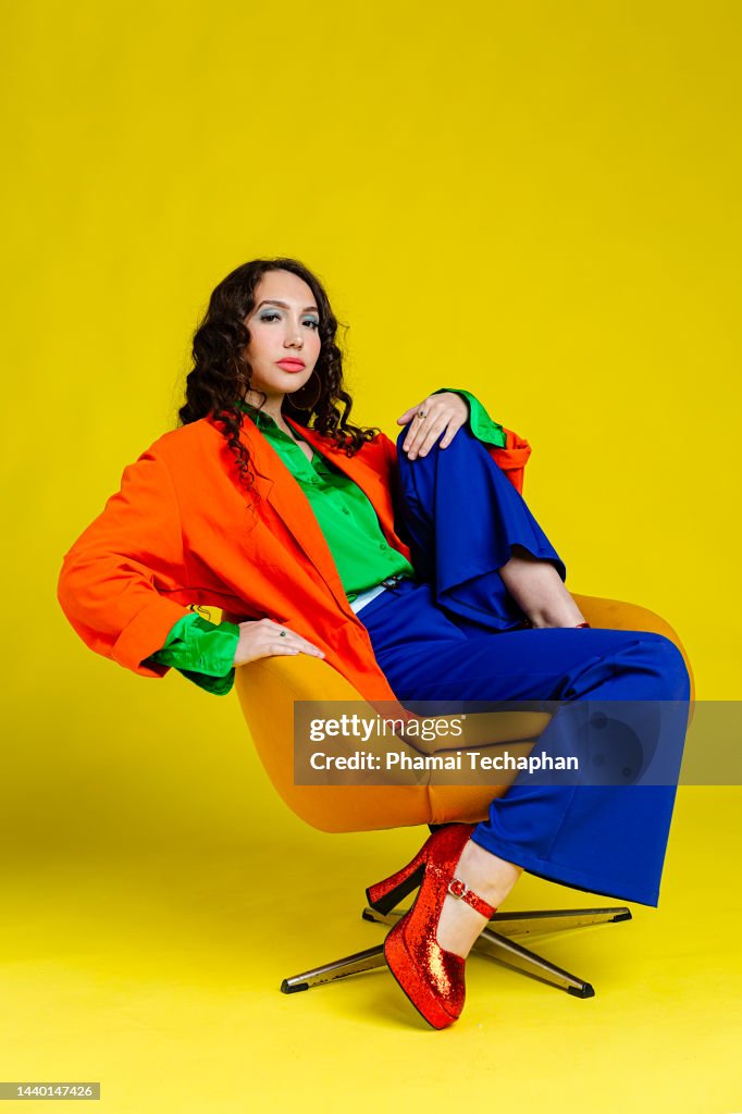 Beautiful woman dresses in colorful outfit