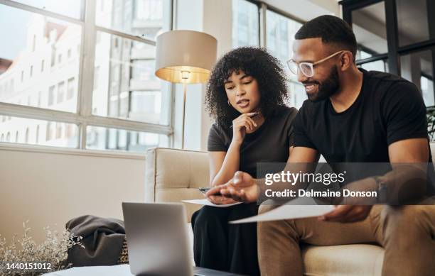 finance, account and black couple with laptop on sofa doing online banking. bills, budget and black man and woman with documents, paperwork and computer doing banking, payment and check bank account - couple shopping stock pictures, royalty-free photos & images