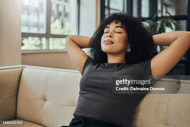 wellness, peace and black woman relax on sofa for health lifestyle, stress relief or healthy mindset. calm, dream and young girl sleeping in living room for rest, comfort break or freedom of the mind - relax brain bildbanksfoton och bilder