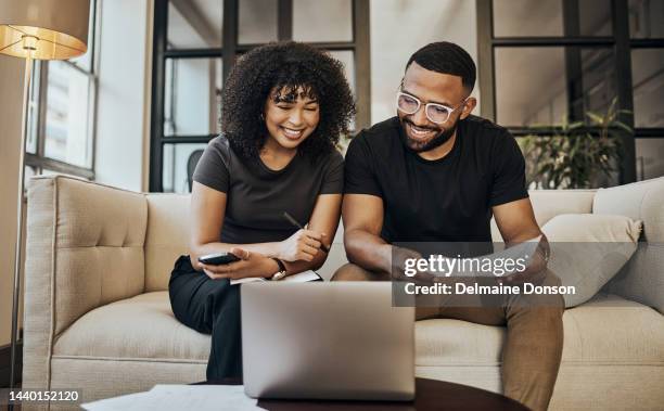 planning, finance and couple with paper and laptop for budget, insurance and savings on sofa of their house. happy, young and man and woman learning about online investment and loan with documents - loan agreement stock pictures, royalty-free photos & images