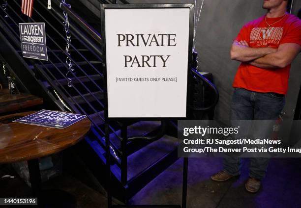 Bouncer stands guard of the stairs to Republican Congresswoman Lauren Boeberts private party in the room above the main party hosted by the...