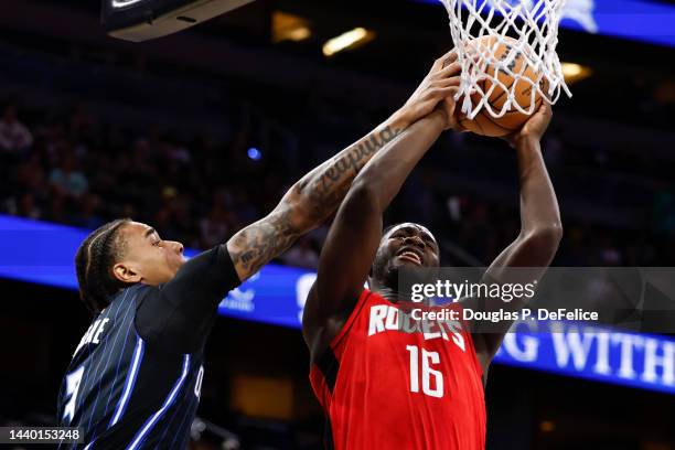 Usman Garuba of the Houston Rockets drives for the net as Chuma Okeke of the Orlando Magic defends during the first quarter at Amway Center on...