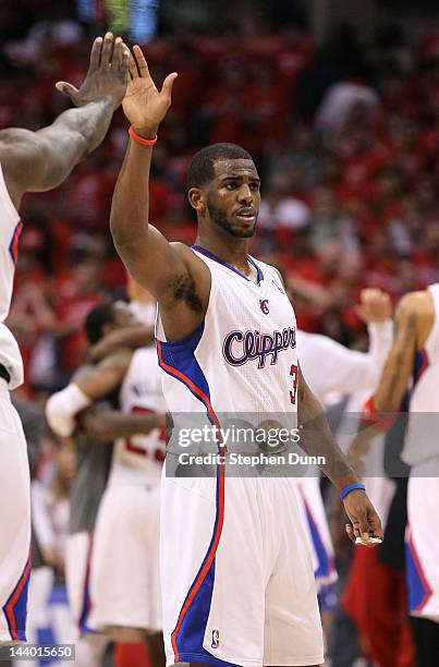 Chris Paul of the Los Angeles Clippers high fives a teammate during the overtime with the Memphis Grizzlies in Game Four of the Western Conference...