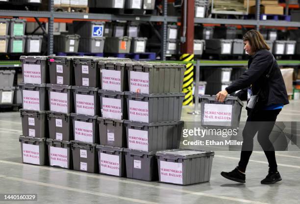Clark County Election Department worker stacks empty crates that contained surrendered mail ballots that were turned in at polling places by people...