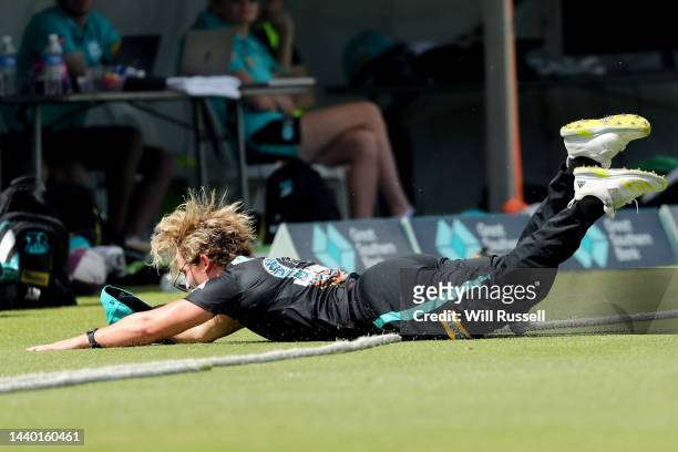 Laura Harris of the Heat tries to stop a four during the Women's Big Bash League match between the Perth Scorchers and the Brisbane Heat at Lilac...