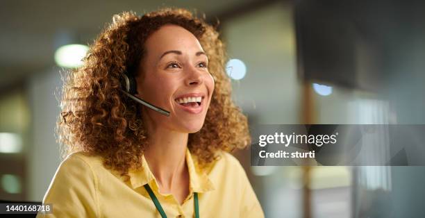 speaking to a friendly voice - friendly customer service rep female stock pictures, royalty-free photos & images