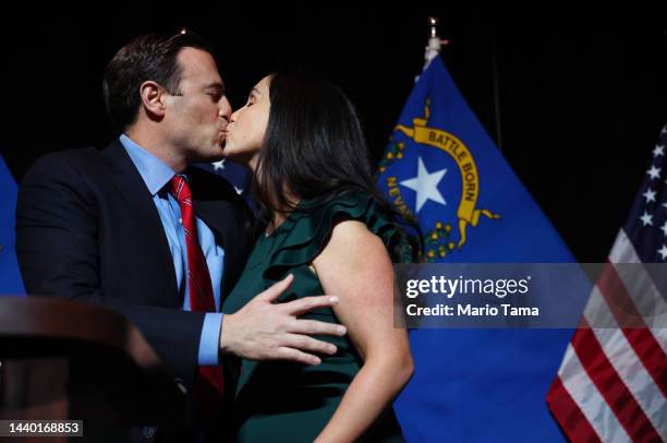 Nevada Republican Senate nominee Adam Laxalt kisses his wife, Jamie Laxalt at a Republican midterm election night party at Red Rock Casino on...