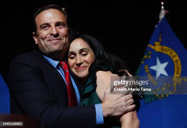 Nevada Republican Senate nominee Adam Laxalt hugs his wife, Jamie Laxalt, at a Republican midterm election night party at Red Rock Casino on November...