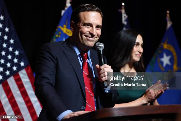 Nevada Republican Senate nominee Adam Laxalt speaks as his wife Jaime Laxalt looks on at a Republican midterm election night party at Red Rock Casino...