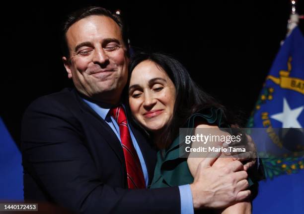 Nevada Republican Senate nominee Adam Laxalt hugs his wife, Jamie Laxalt, at a Republican midterm election night party at Red Rock Casino on November...