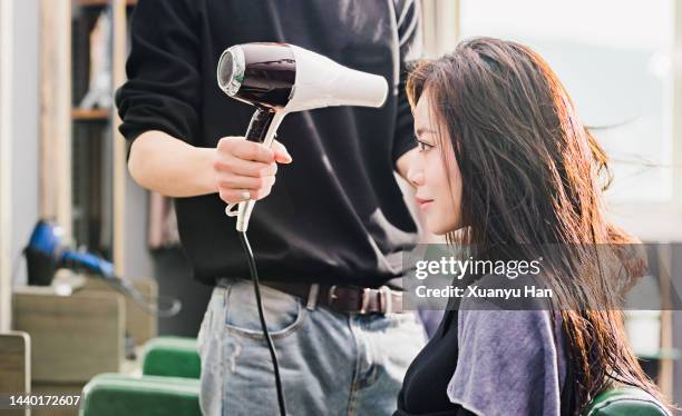 hairdresser working on customer - hair treatment stock pictures, royalty-free photos & images