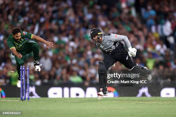 Devon Conway of New Zealand is run out by Shadab Khan of Pakistan for 21 runs during the ICC Men's T20 World Cup Semi Final match between New Zealand...