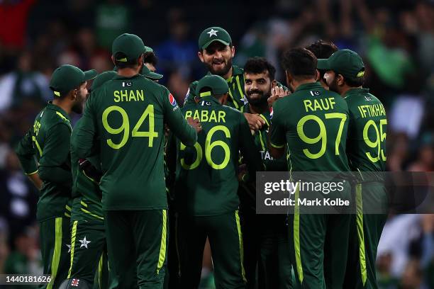 Shadab Khan of Pakistan celebrates with his team after running out Devon Conway of New Zealand with a direct hit during the ICC Men's T20 World Cup...