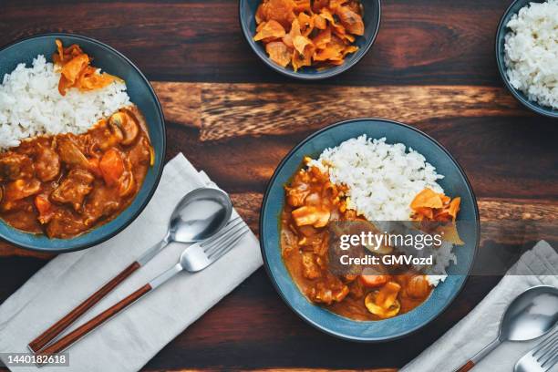 enjoying japanese food: japanese beef curry - yōshoku stockfoto's en -beelden