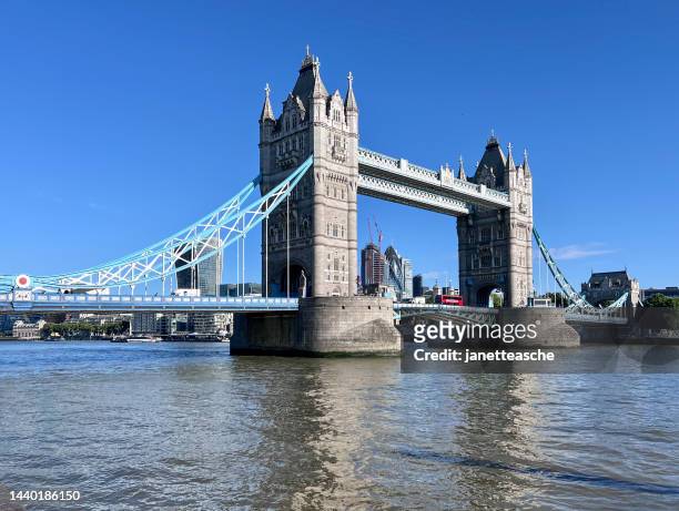 tower bridge and the river thames from thames path at butler's wharf, shad thames, south bank, london, england, uk - shad stock pictures, royalty-free photos & images