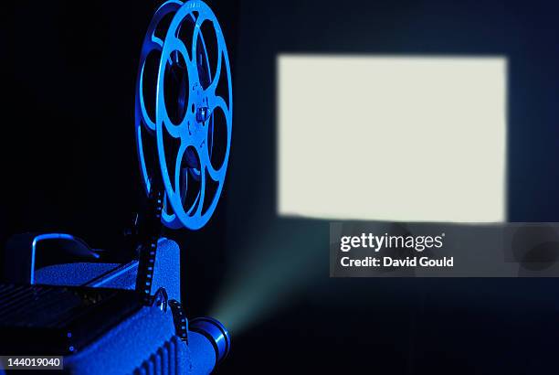 8mm film projector running and blank screen - slide projector stock pictures, royalty-free photos & images