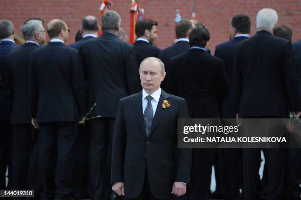 Russian President Vladimir Putin attends a ceremony in honour of World War II veterans, heroes and battles near the Tomb of the Unknown Soldier in...