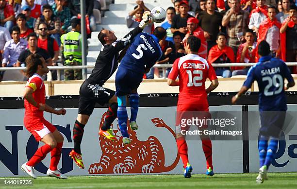 Goalkeeper Asmir Avdukic of Persepolis F.C. Punches the ball clear during the AFC Champions League match between Persepolis F.C. And Al Hilal at...