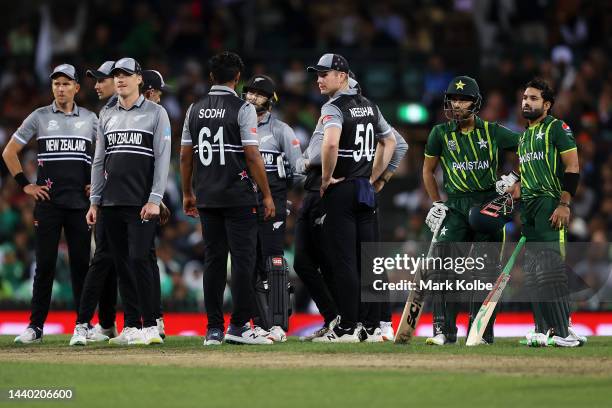 Mohammad Haris and Mohammad Rizwan of Pakistan watch on as the DRS is used during the ICC Men's T20 World Cup Semi Final match between New Zealand...