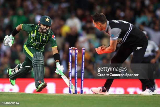 Mohammad Rizwan of Pakistan grounds his bat as Tim Southee of New Zealand attempts to run him out during the ICC Men's T20 World Cup Semi Final match...