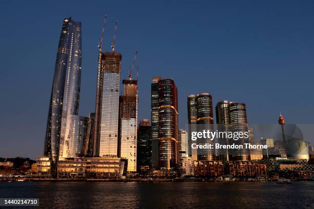 Buildings at Barangaroo are illuminated at sunset on November 09, 2022 in Sydney, Australia. Barangaroo, one of Sydney's largest redevelopment sites,...