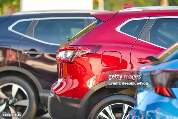side view of a line of parked cars, in hamburg - second hand car stock pictures, royalty-free photos & images